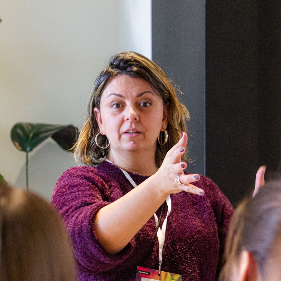 Prof. Dr. Ana Adi speaking at a workshop